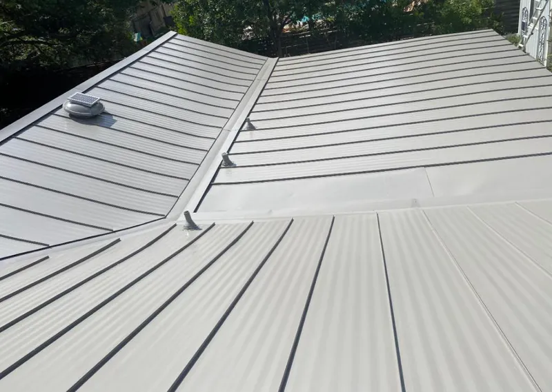 Solar attic fan installed on a metal roof for Roof Ventilation in Arden-Arcade